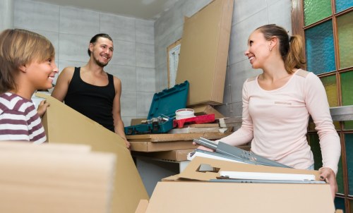 Professional movers handling office equipment during a Mayfair relocation