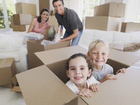 Packing and wrapping household items for a move in Mayfair