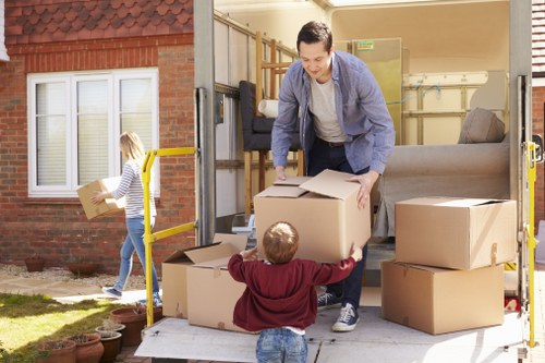 Loading and unloading moving boxes near a Mayfair property