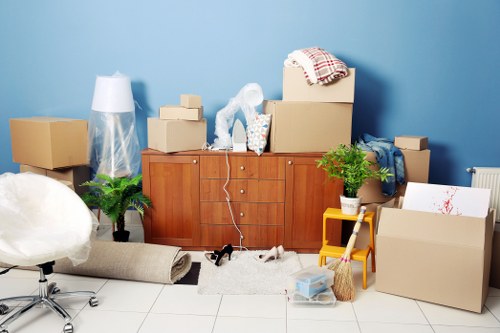 Furniture removal team preparing items for a move in a Mayfair property