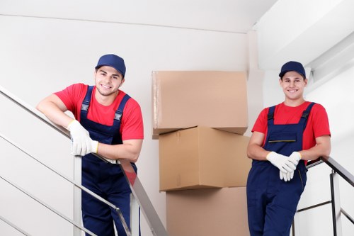 Moving crew safely loading furniture into a van