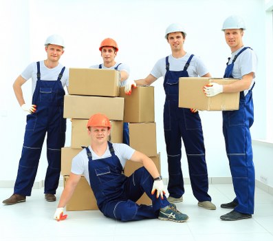 Student removals team working carefully in a Mayfair street with boxes and furniture
