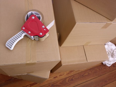 Professional movers handling boxes and furniture in Mayfair