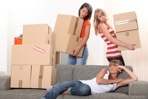 Professional movers collecting household items from a Mayfair property
